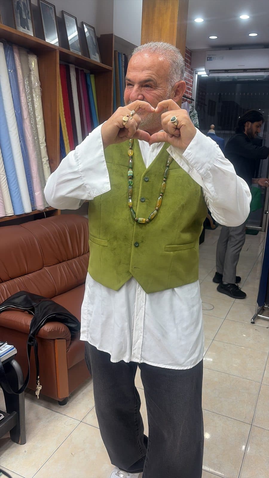 Client fitting photo inside the Bang Rak tailoring shop