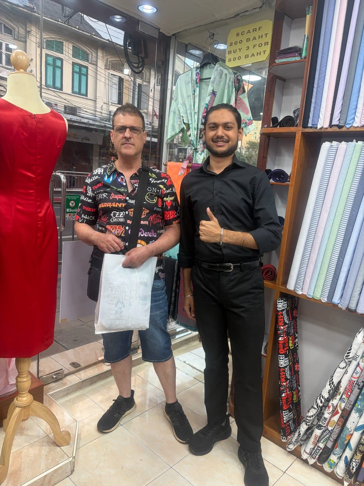 Client fitting photo inside the Bang Rak tailoring shop